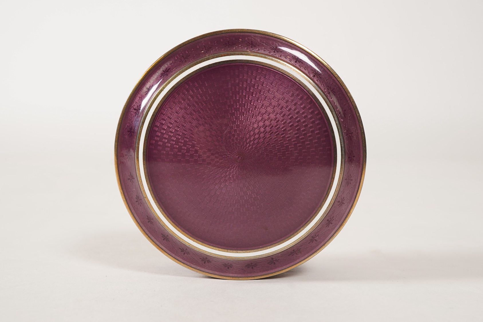 A late 19th/early 20th century North American sterling and mauve guilloche enamel circular box and cover, by Theodore B. Starr Inc, New York